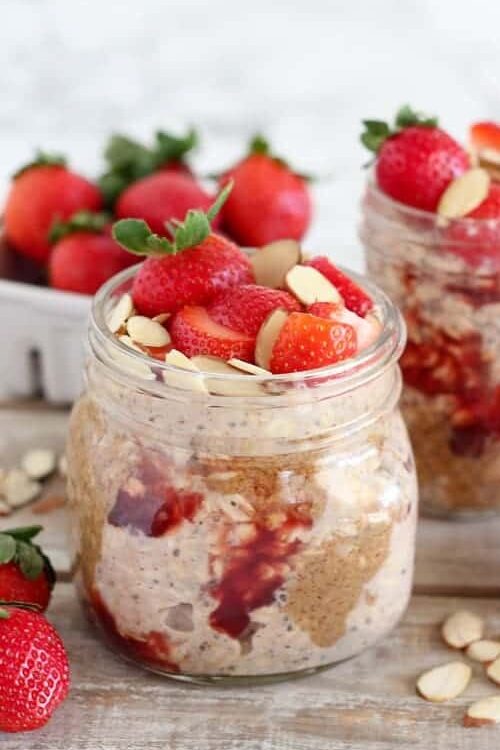 strawberry overnight oats in a mason jar

